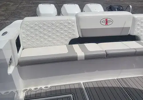  A white boat with seating is serviced by Marine Kings of Miami with boat maintenance services in Miami, Florida.