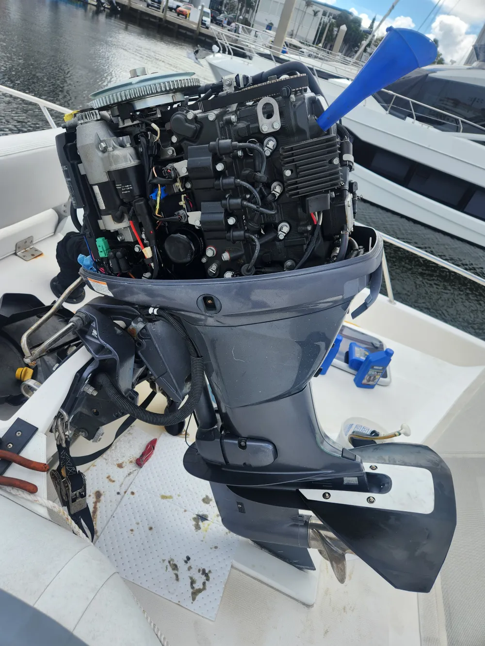  An outboard motor is serviced by Marine Kings of Miami with outboard engine service in Miami, Florida.