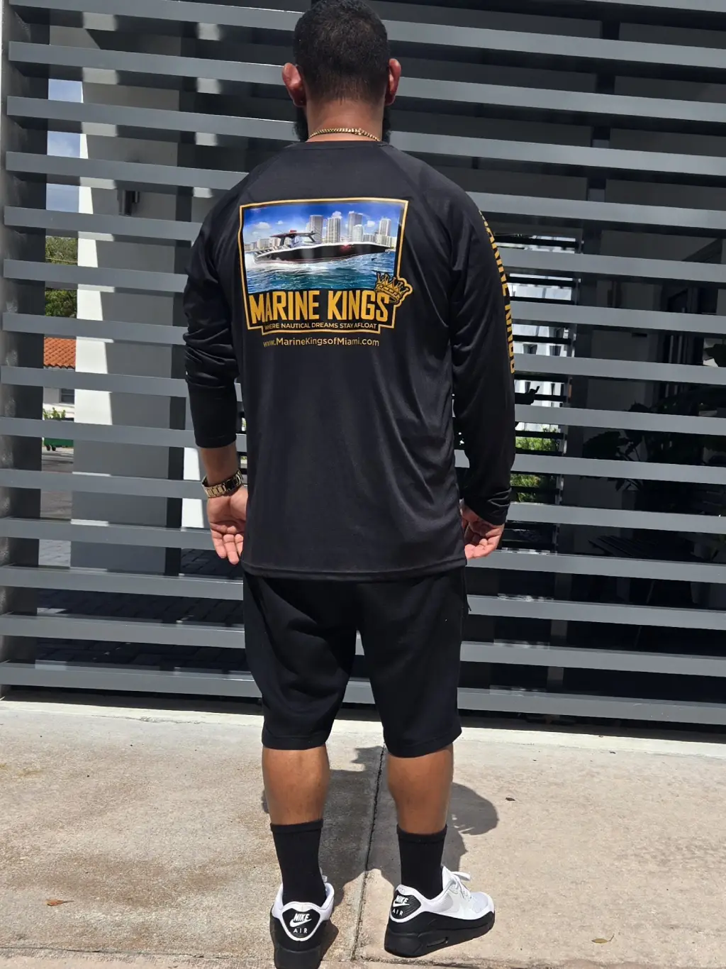  A Marine Kings shirt worn by Nicolle reflects boat maintenance services in Miami, Florida.