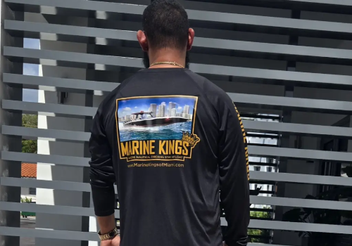  A Marine Kings shirt worn by Nicolle reflects boat maintenance services in Miami, Florida.