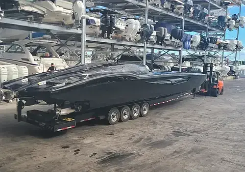  A boat stored in a garage is maintained by Marine Kings of Miami with boat maintenance services.