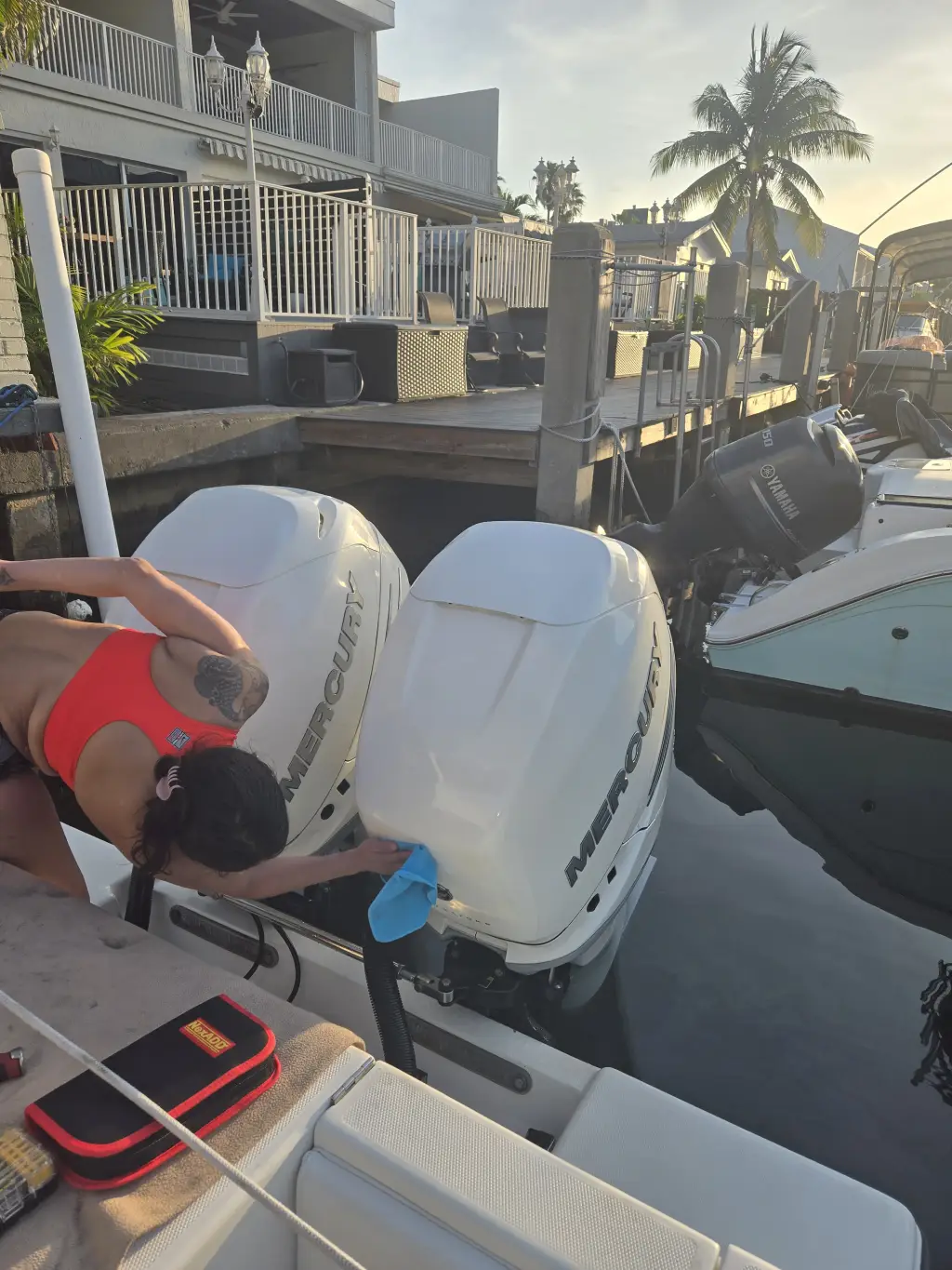 Motor inspection by Nicolle demonstrates marine engine diagnostics at Marine Kings of Miami.