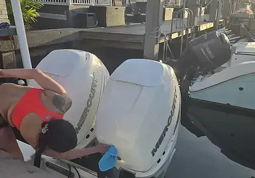 Motor inspection by Nicolle demonstrates marine engine diagnostics at Marine Kings of Miami.