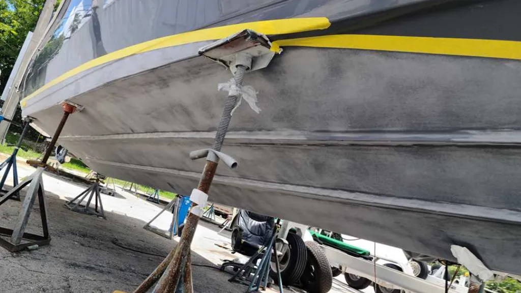 Crew members work on a vessel while Marine Kings of Miami provides boat maintenance services in Miami, Florida.