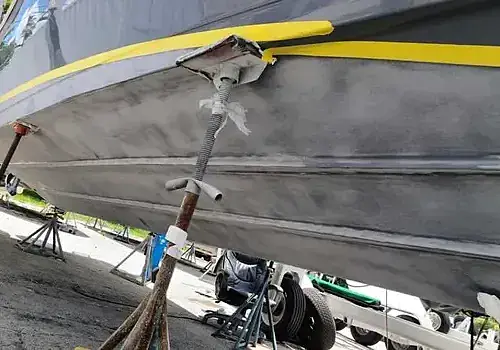 Crew members work on a vessel while Marine Kings of Miami provides boat maintenance services in Miami, Florida.