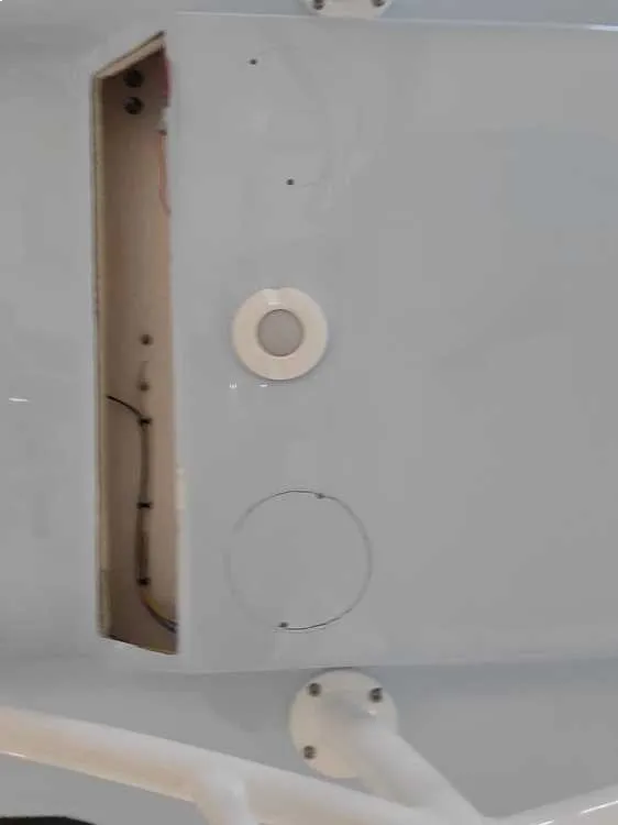  A white door with openings is handled by Marine Kings of Miami with boat repair Miami in Miami, Florida.