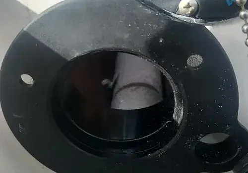 A ball bearing is inspected by Marine Kings of Miami using marine engine diagnostics in Miami, Florida.