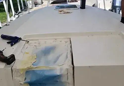  Painting on a boat is completed by Marine Kings of Miami as part of boat maintenance services in Miami, Florida.