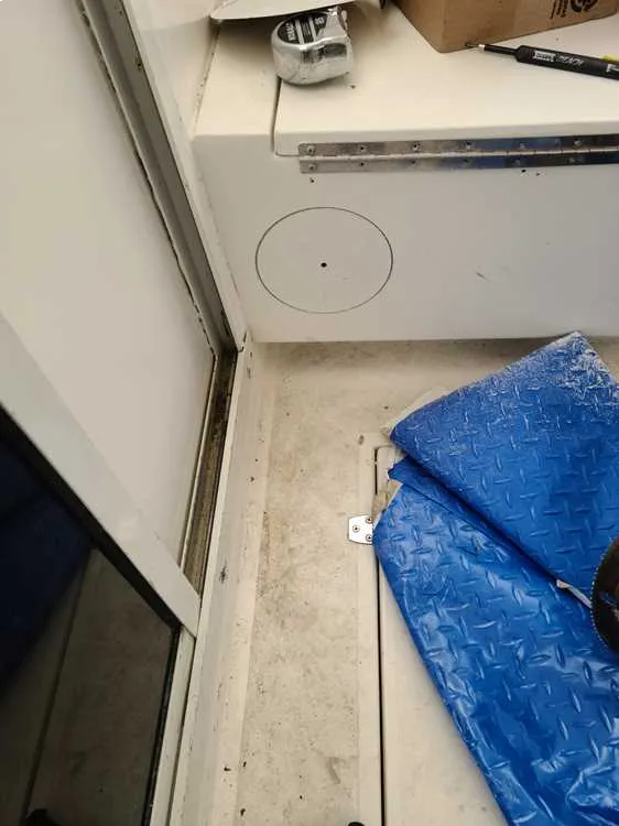  A blanket on the floor reflects workspace areas used by Marine Kings of Miami for boat maintenance services.