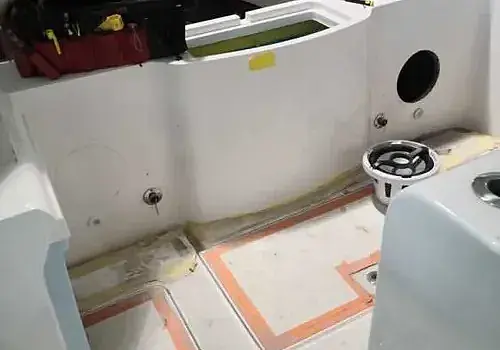 A bathroom with two toilets is maintained by Marine Kings of Miami with plumbing services.