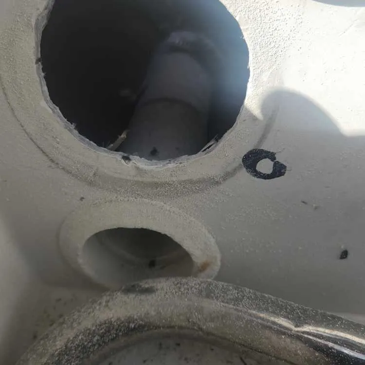 A man in a hole reflects labor involved in boat repair Miami by Marine Kings of Miami.