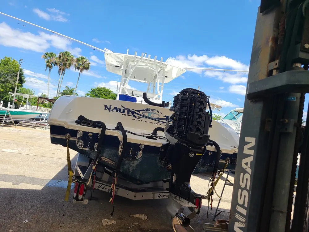  A boat in a parking lot is maintained by Marine Kings of Miami with boat maintenance services in Miami, Florida.