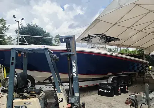  A vessel near a trailer is serviced by Marine Kings of Miami with boat repair Miami.