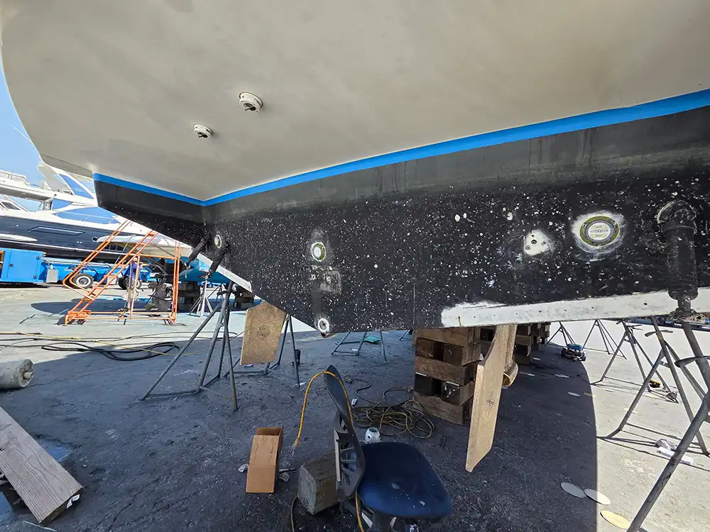 A vessel under repair is handled by Marine Kings of Miami with boat maintenance services.