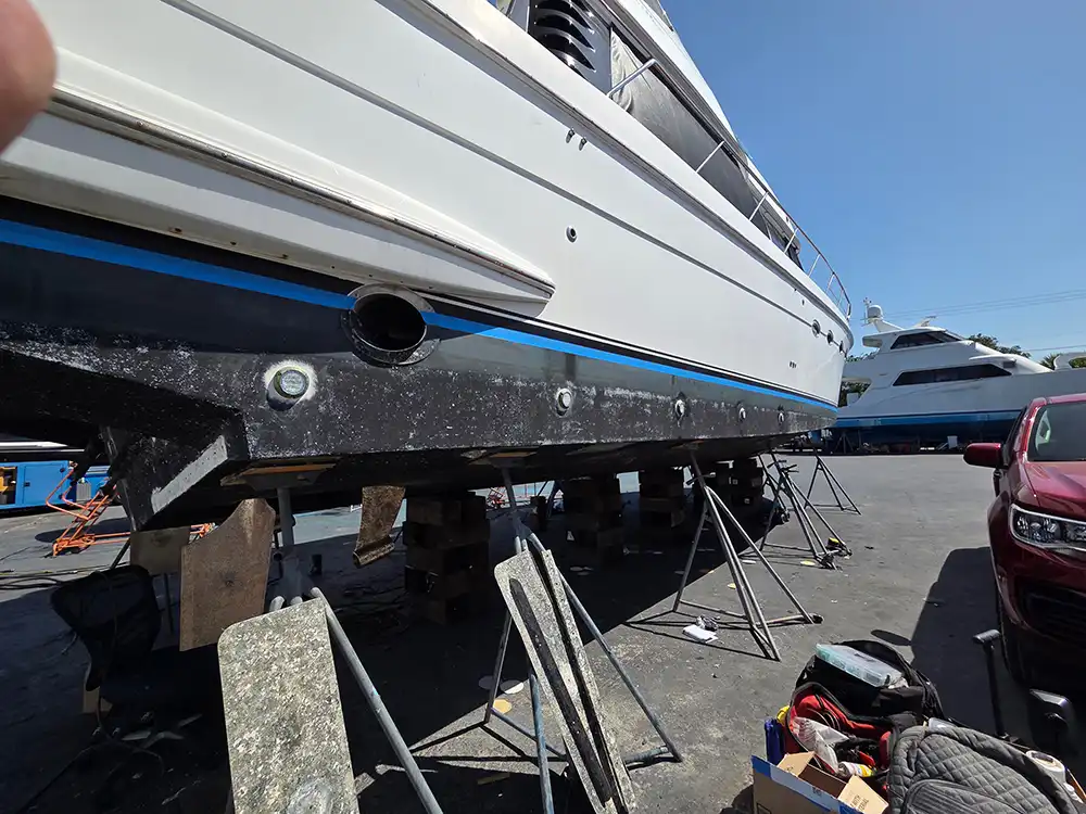  A towed vessel is transported for boat repair Miami by Marine Kings of Miami in Miami, Florida.