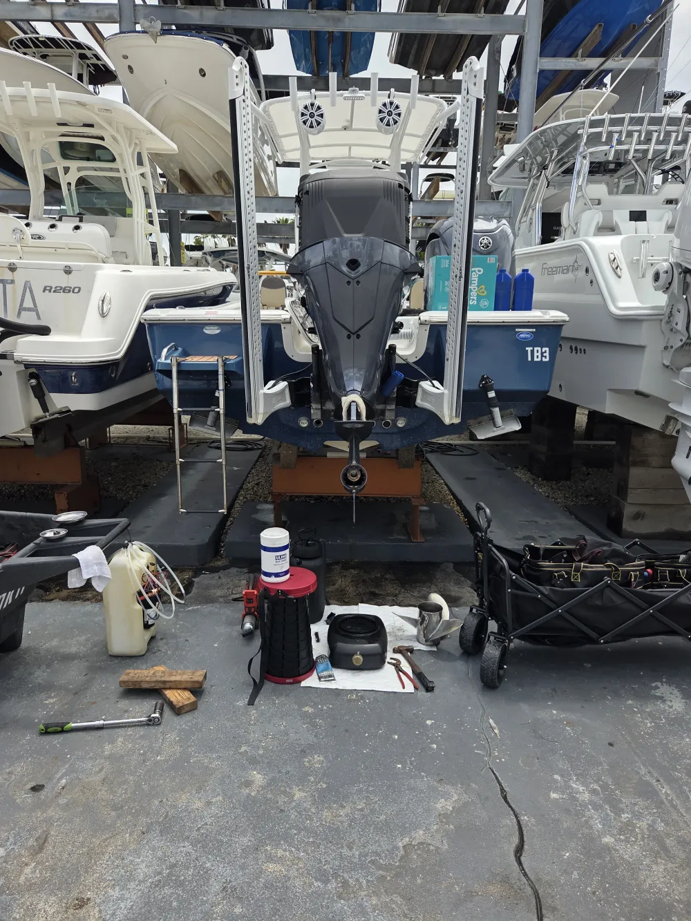 A boat stored in the garage is handled by Marine Kings of Miami with boat maintenance services.