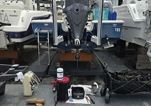 A boat stored in the garage is handled by Marine Kings of Miami with boat maintenance services.