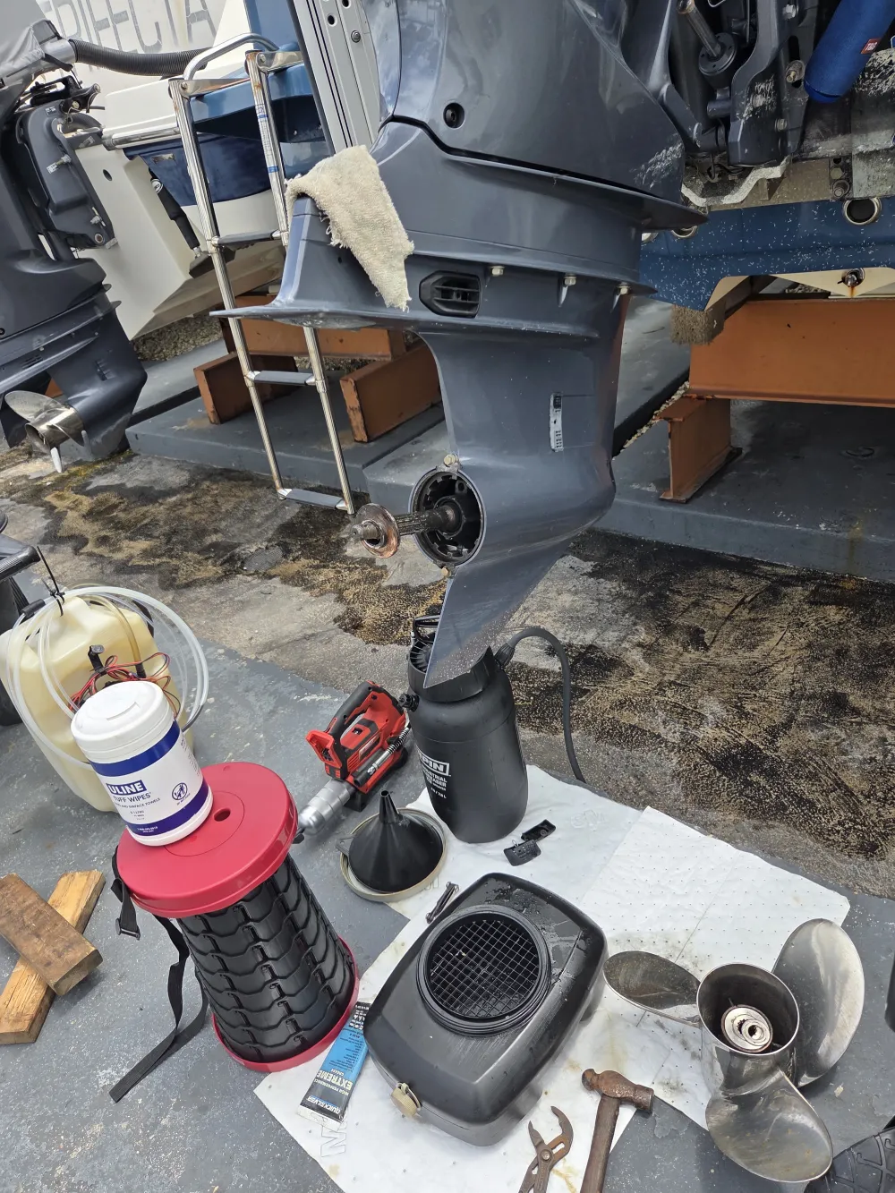 Using a power tool, Marine Kings of Miami performs boat repair Miami on flooring.