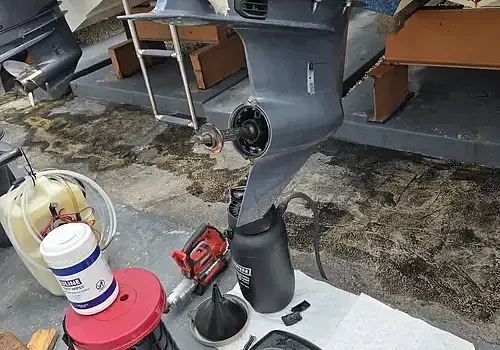 Using a power tool, Marine Kings of Miami performs boat repair Miami on flooring.