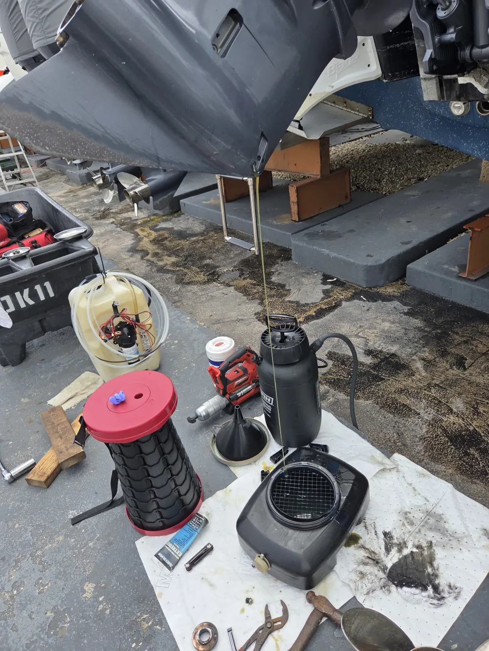 Tools on the ground are used by Marine Kings of Miami for boat maintenance services in Miami, Florida.