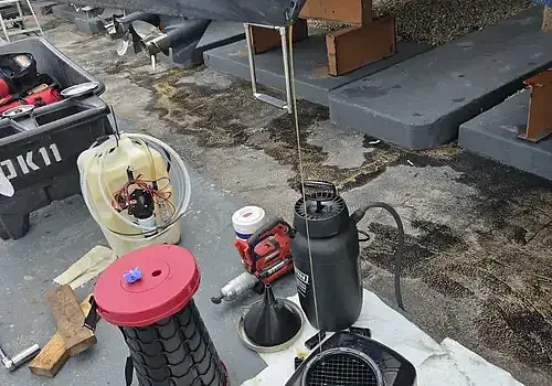 Tools on the ground are used by Marine Kings of Miami for boat maintenance services in Miami, Florida.