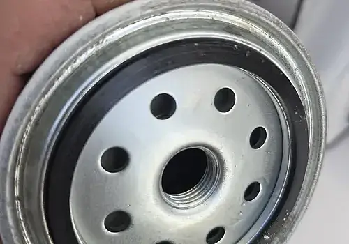 A metal canister is inspected by Marine Kings of Miami during boat maintenance services.