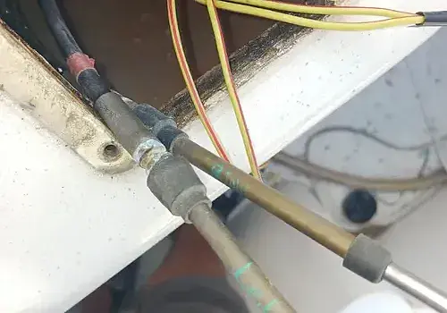 Electrical wires on a home are repaired by Marine Kings of Miami using marine electrical troubleshooting.