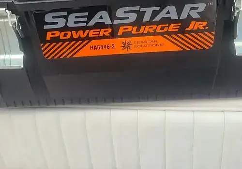  A white couch appears in a space supported by Marine Kings of Miami boat maintenance services.