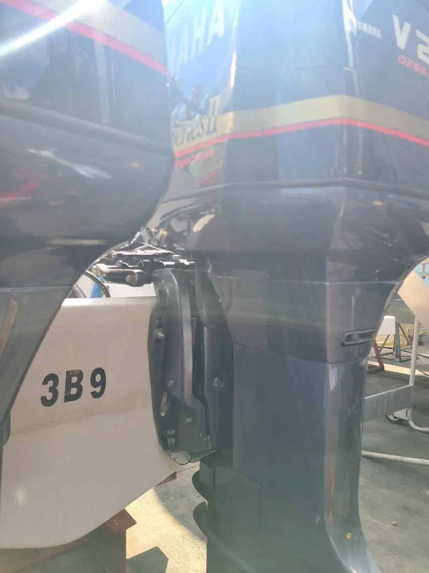 A man stands before a machine while Marine Kings of Miami performs boat maintenance services in Miami, Florida.
