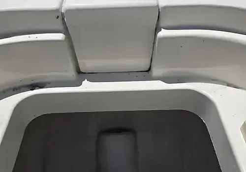 A raised seat exposes areas serviced by Marine Kings of Miami with boat repair Miami in Miami, Florida.