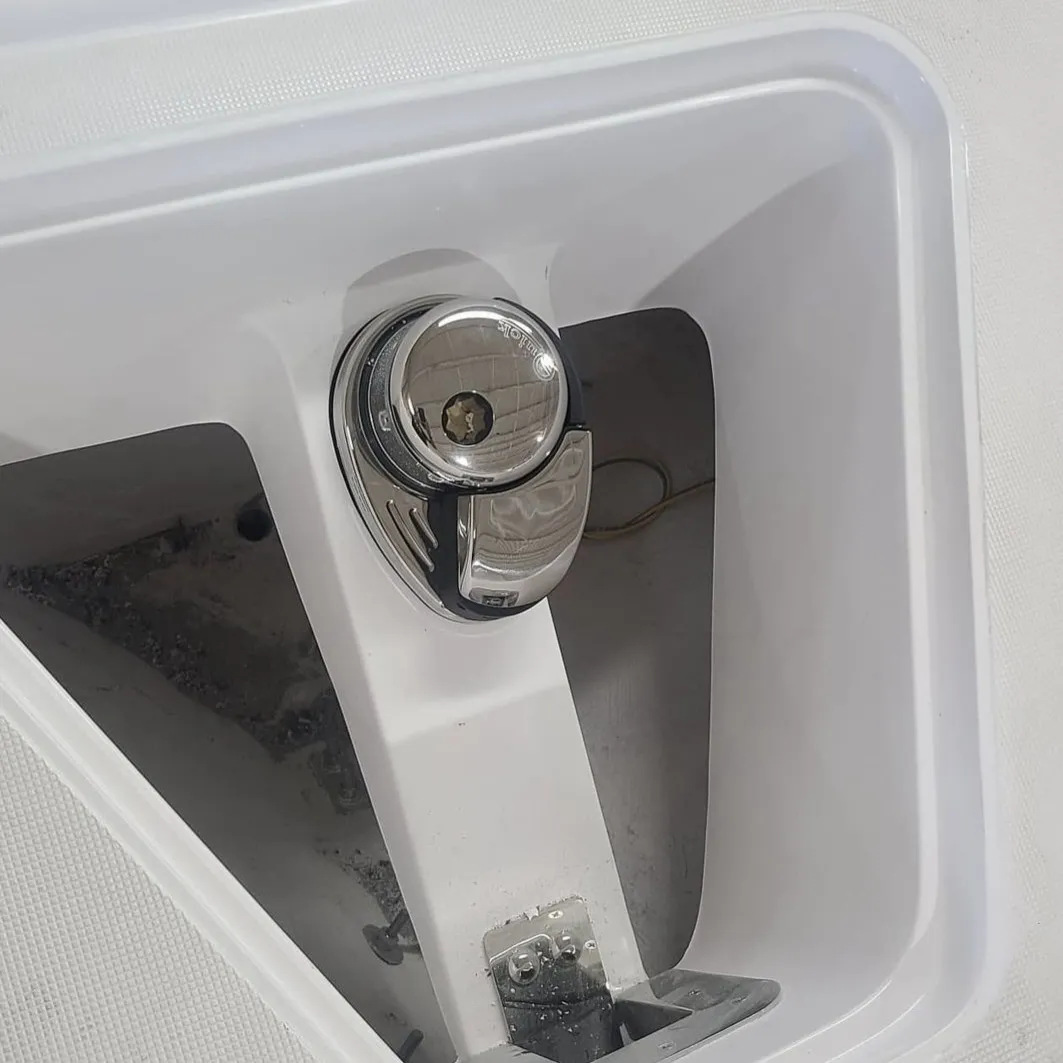  A boat door latch is checked by Marine Kings of Miami with boat repair Miami.