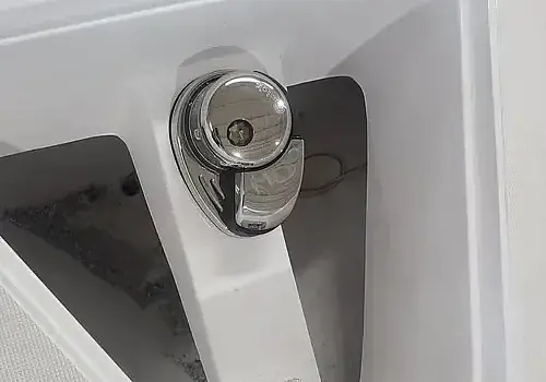  A boat door latch is checked by Marine Kings of Miami with boat repair Miami.